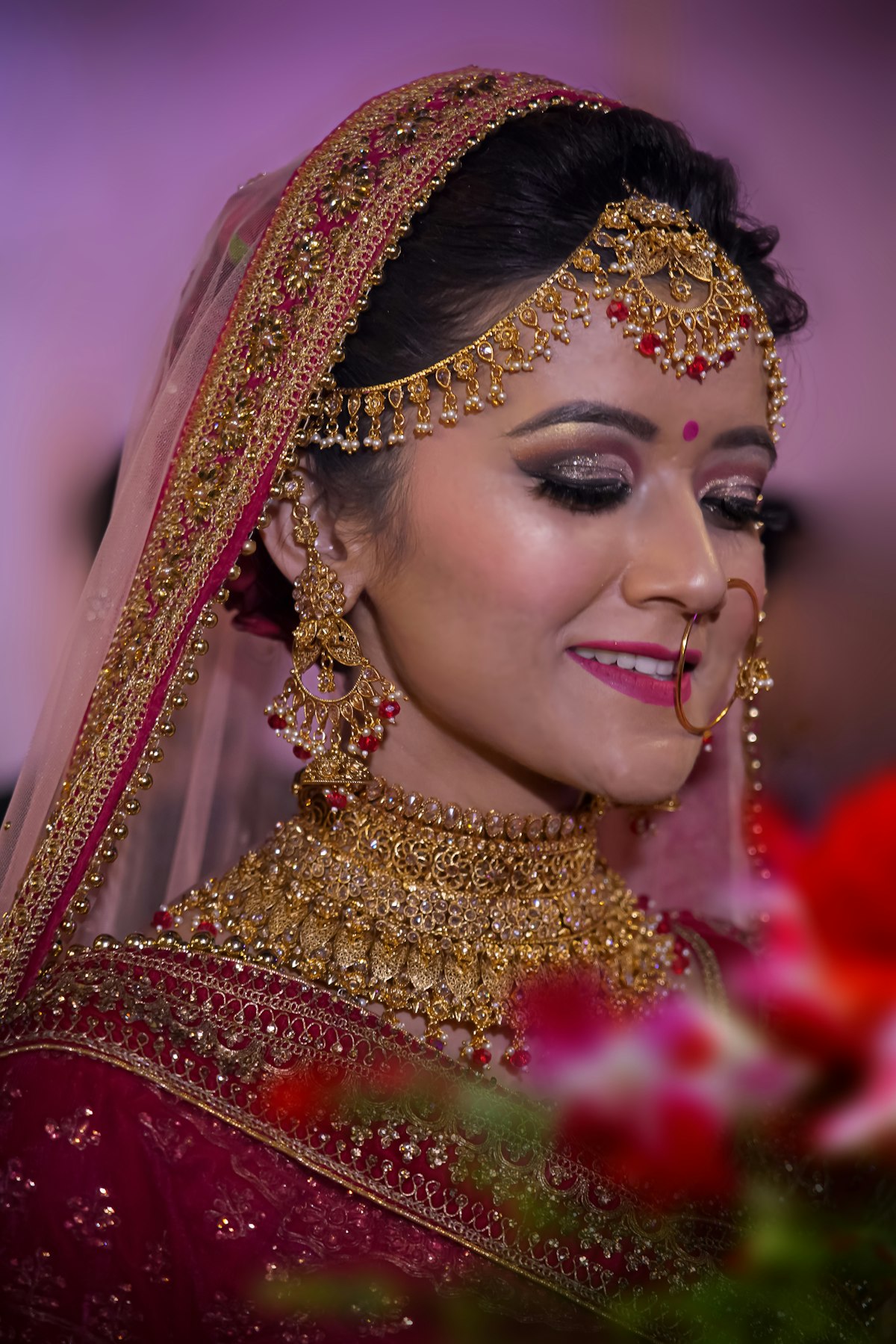 A bride with traditional bridal makeup and jewelry